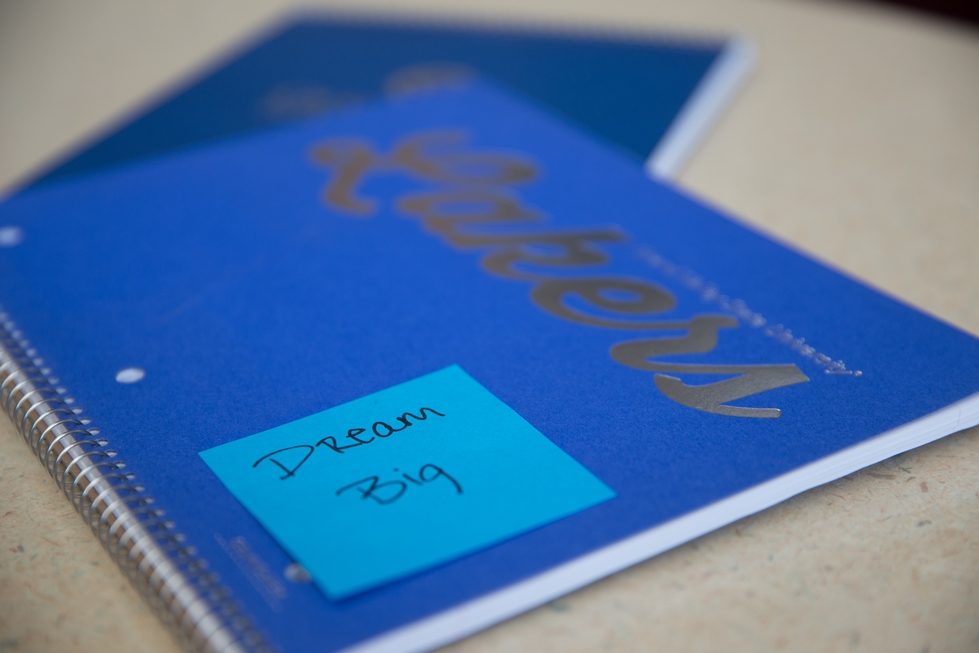 Notebook with sticky note titled "Dream Big"